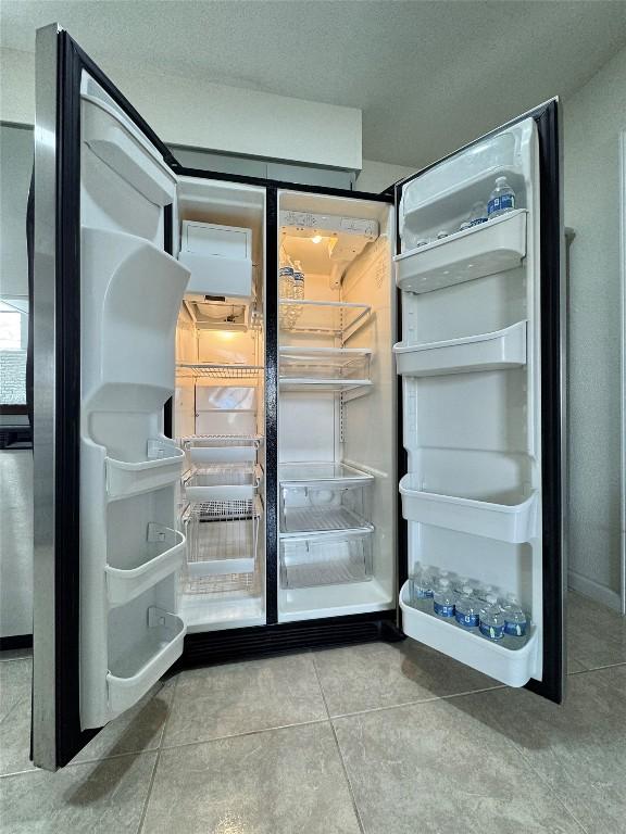 1206 Hackberry Dr, Marble Falls, TX 78654 - kitchen view of refrigerator