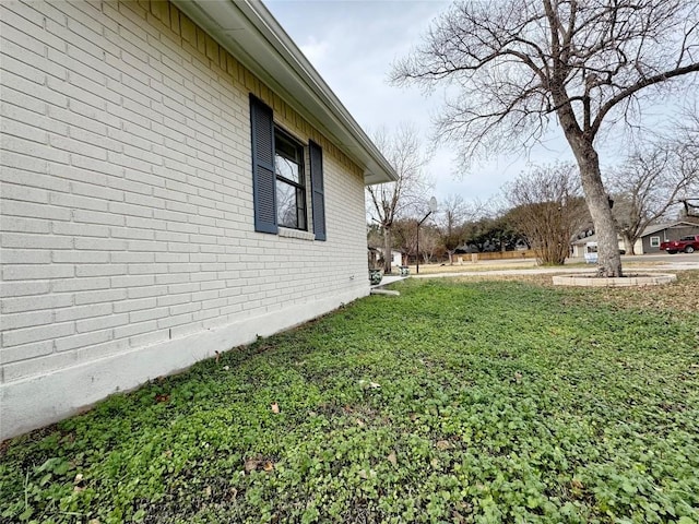 1206 Hackberry Dr, Marble Falls, TX 78654 - view of home's exterior featuring brick siding and a yard