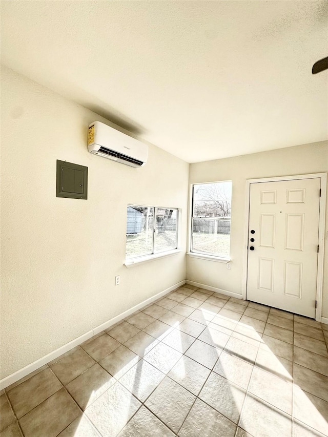 tiled entrance foyer featuring electric panel and a wall mounted AC