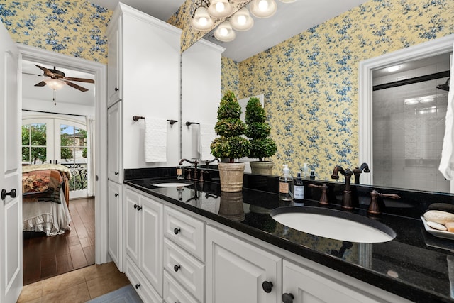 bathroom featuring walk in shower, vanity, tile patterned flooring, ceiling fan, and french doors