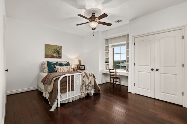 bedroom featuring ceiling fan, a closet, and dark hardwood / wood-style floors