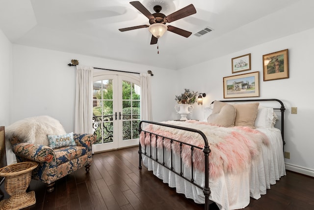 bedroom with ceiling fan, dark hardwood / wood-style flooring, and french doors