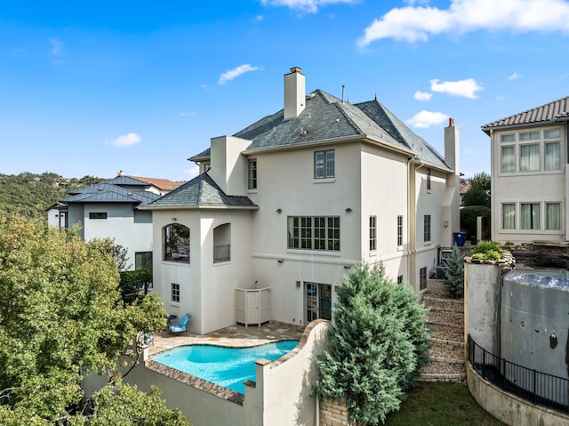 back of house featuring a patio