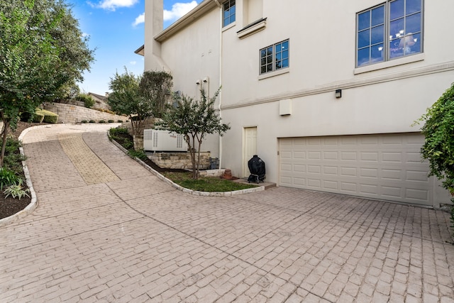 view of side of property featuring a garage