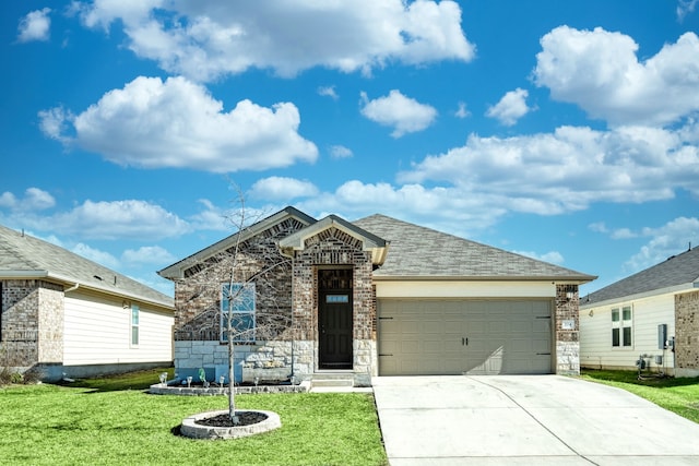 view of front facade with a garage and a front yard