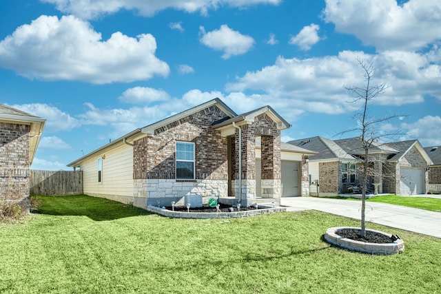 view of front of house with a front yard and a garage