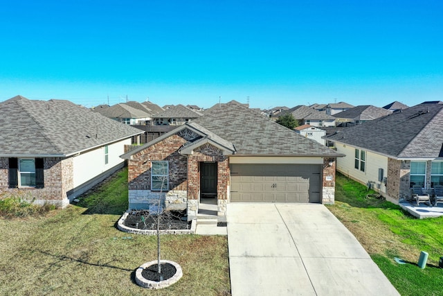 ranch-style house with a garage and a front yard