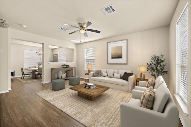 living room with ceiling fan and hardwood / wood-style floors