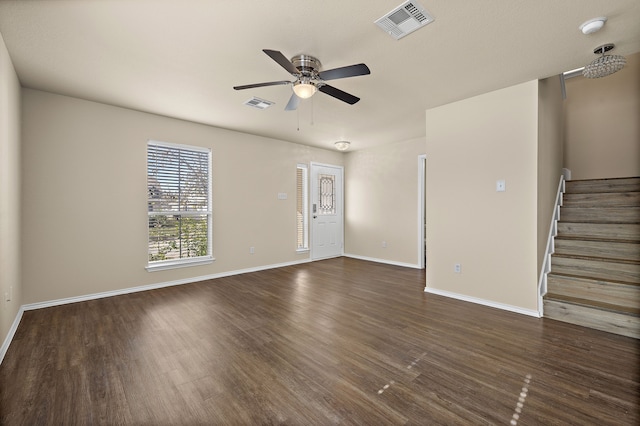 interior space with ceiling fan and dark hardwood / wood-style flooring