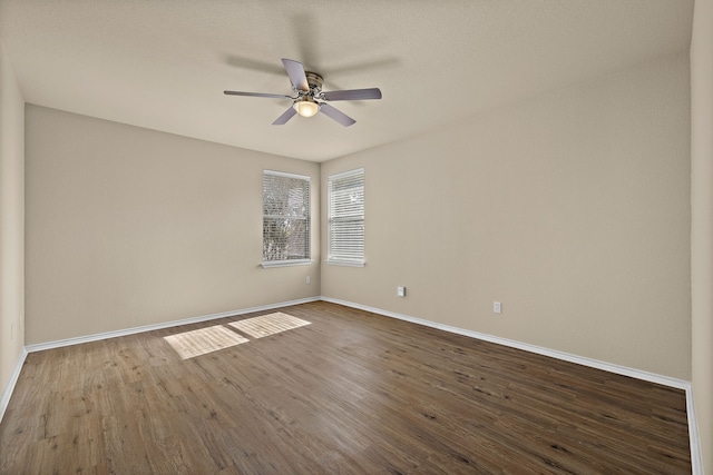 empty room featuring ceiling fan and wood-type flooring