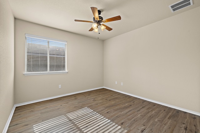 spare room with hardwood / wood-style flooring