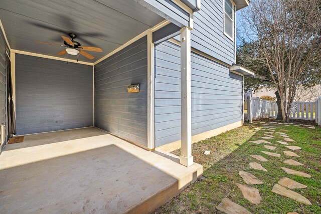 exterior space featuring ceiling fan