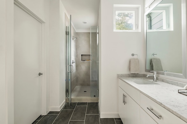 bathroom featuring tile patterned floors, an enclosed shower, vanity, and crown molding