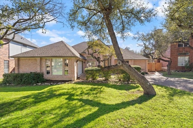 10113 Planters Woods Dr, Austin, TX 78730 - view of front facade with brick siding and roof with shingles