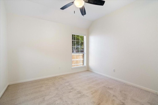 unfurnished room featuring ceiling fan, light carpet, and lofted ceiling