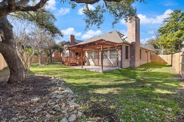 back of house with a fenced backyard, a lawn, a pergola, a chimney, and a patio area