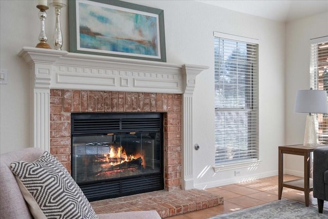 interior details with a fireplace and baseboards