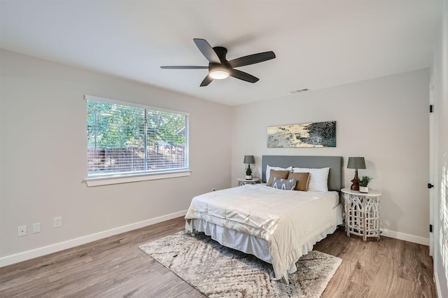 bedroom featuring ceiling fan and wood-type flooring