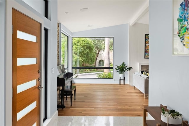 corridor featuring lofted ceiling