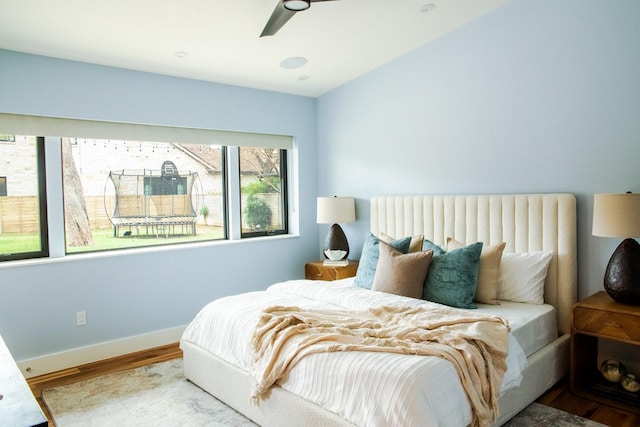 bedroom featuring ceiling fan and wood-type flooring