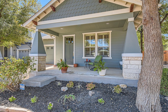 property entrance with covered porch and a garage