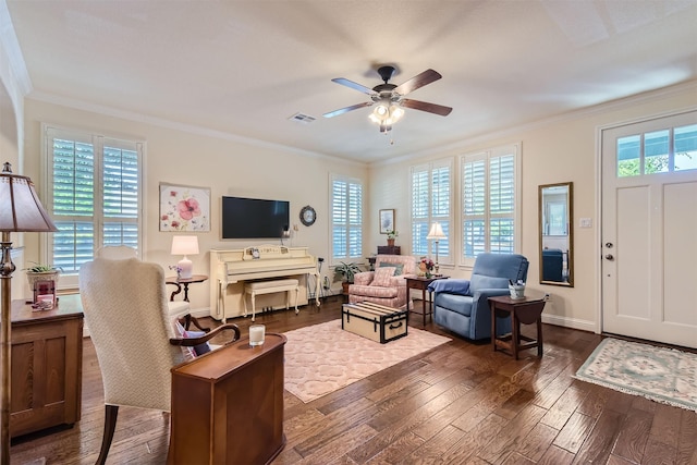 living room featuring ceiling fan, dark wood-type flooring, and ornamental molding