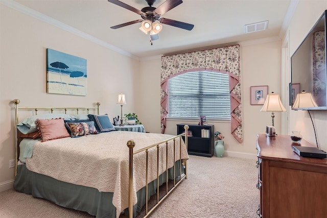 bedroom with ceiling fan, carpet, and crown molding