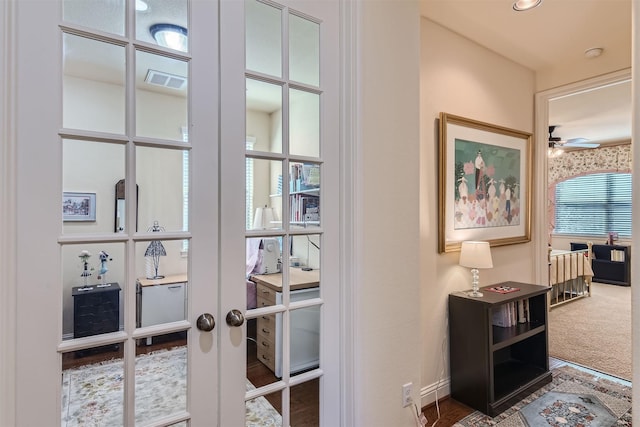 interior space featuring dark colored carpet and french doors