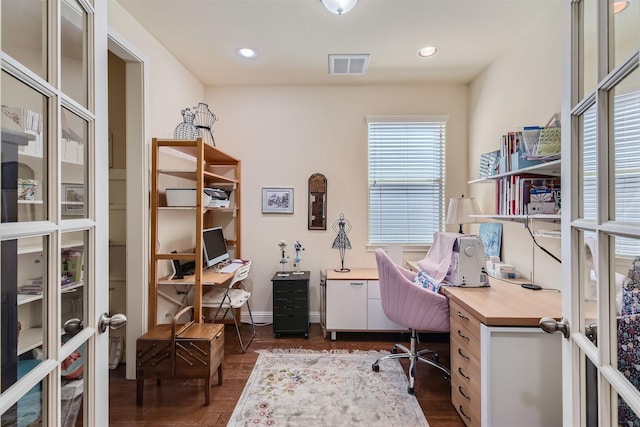 home office with dark hardwood / wood-style floors