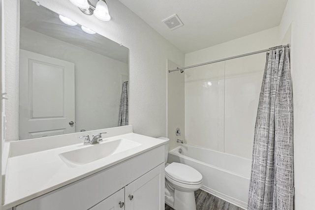 full bathroom featuring toilet, shower / tub combo, vanity, and hardwood / wood-style floors