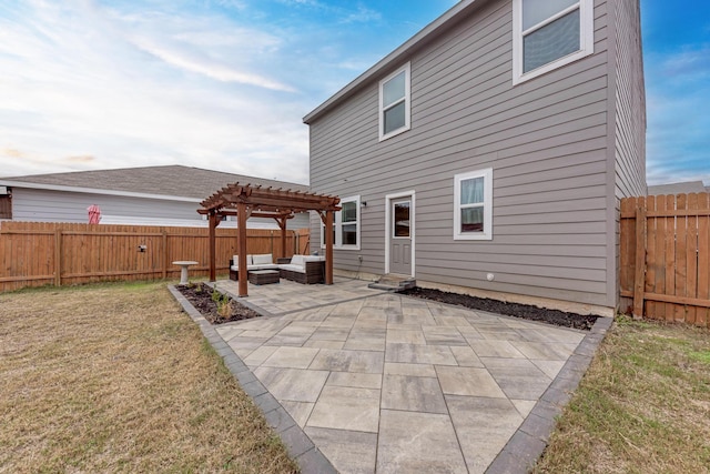 rear view of house featuring a pergola, a patio area, outdoor lounge area, and a yard