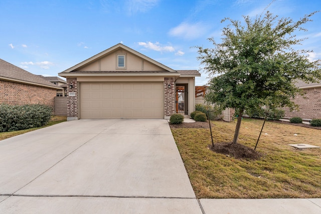 view of front of property featuring a front lawn and a garage