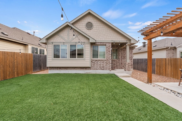 view of front facade with a front yard and a pergola