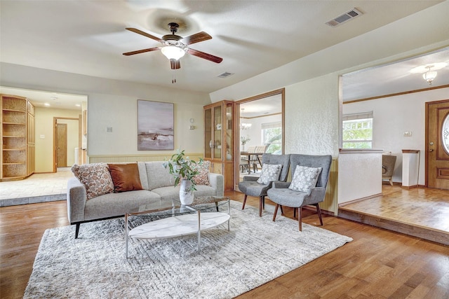 living room featuring hardwood / wood-style flooring and ceiling fan