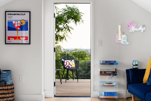 doorway featuring vaulted ceiling