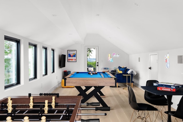 playroom featuring billiards, vaulted ceiling, a healthy amount of sunlight, and light hardwood / wood-style floors