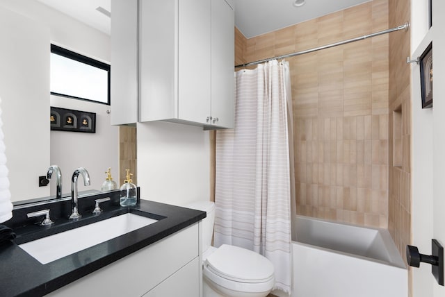 full bathroom featuring toilet, shower / bath combo, and vanity