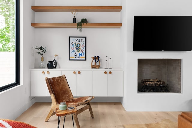 interior space with white cabinets and light wood-type flooring