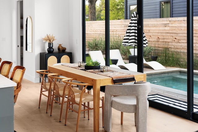 dining space featuring light hardwood / wood-style flooring