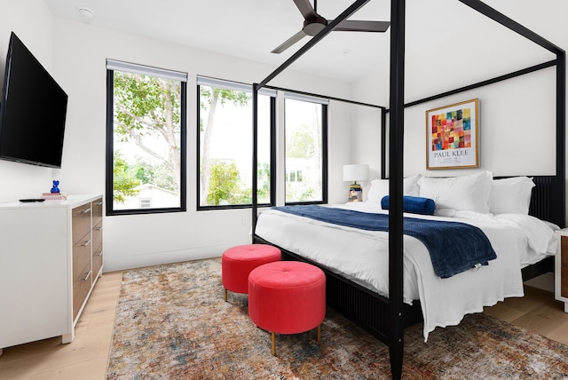 bedroom with ceiling fan and light wood-type flooring