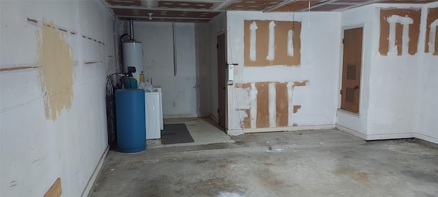 basement featuring gas water heater and washer / clothes dryer