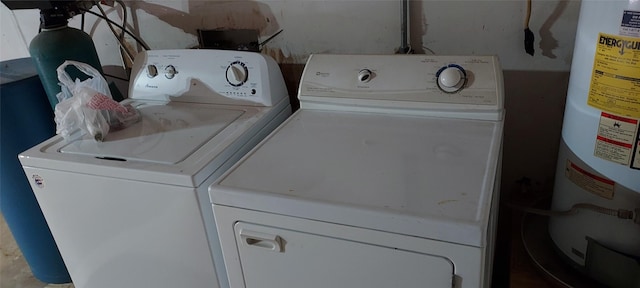 laundry area featuring washer and clothes dryer and water heater