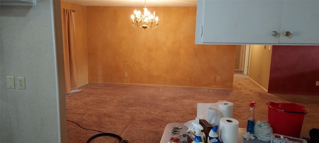 interior space with carpet floors and an inviting chandelier