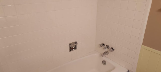 interior space featuring tiled shower / bath