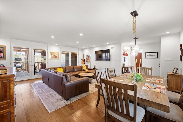 dining area with light hardwood / wood-style floors