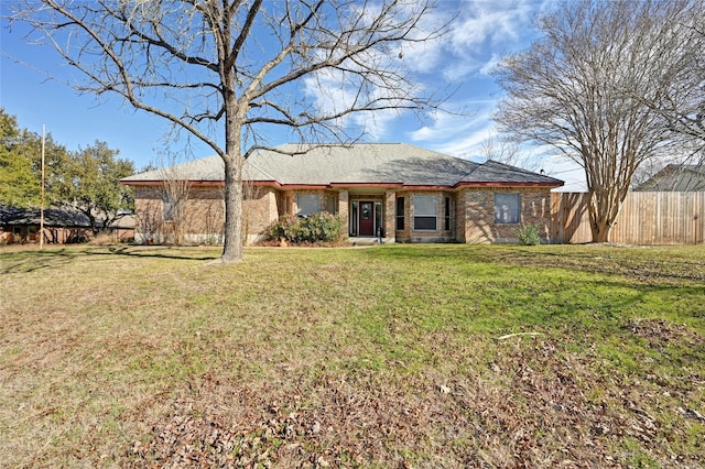 rear view of house featuring a lawn