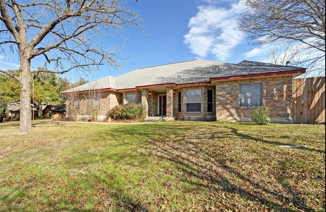 single story home with a front yard