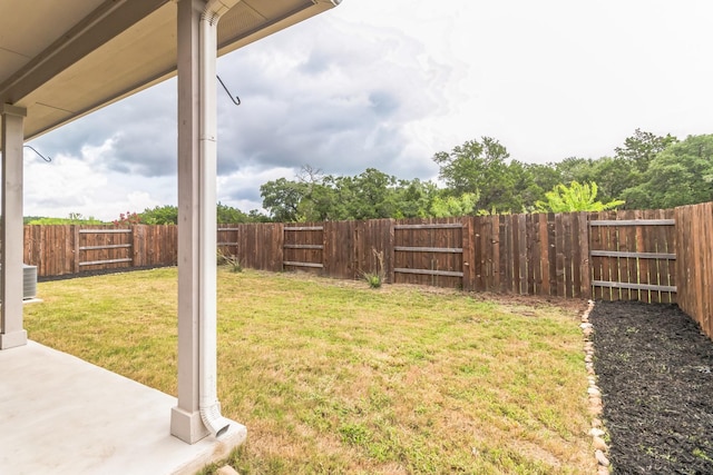 view of yard with central AC