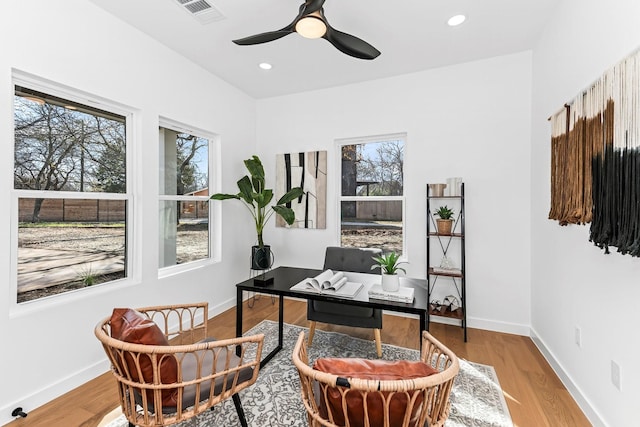 office featuring ceiling fan and light hardwood / wood-style floors