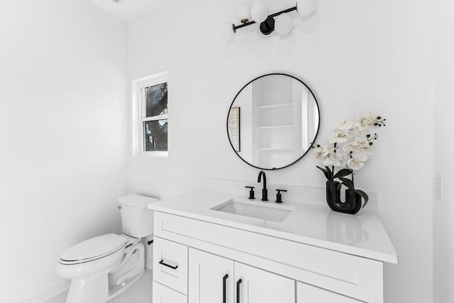 bathroom with toilet and vanity